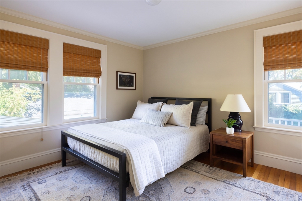 26 Dorset Road Newton, MA 02468 - Photo 15 of 22 a bedroom with a bed and a window
