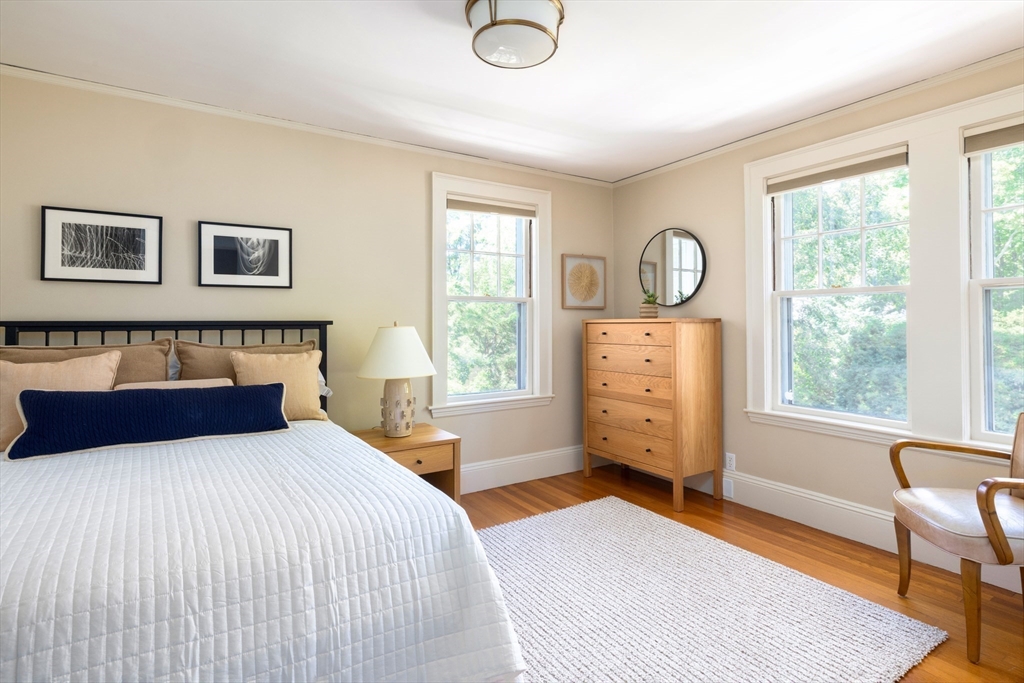 26 Dorset Road Newton, MA 02468 - Photo 16 of 22 a bedroom with a large bed and a window