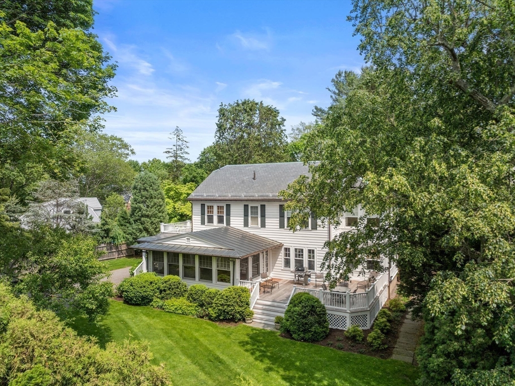 26 Dorset Road Newton, MA 02468 - Photo 19 of 22 a view of a big yard next to a building