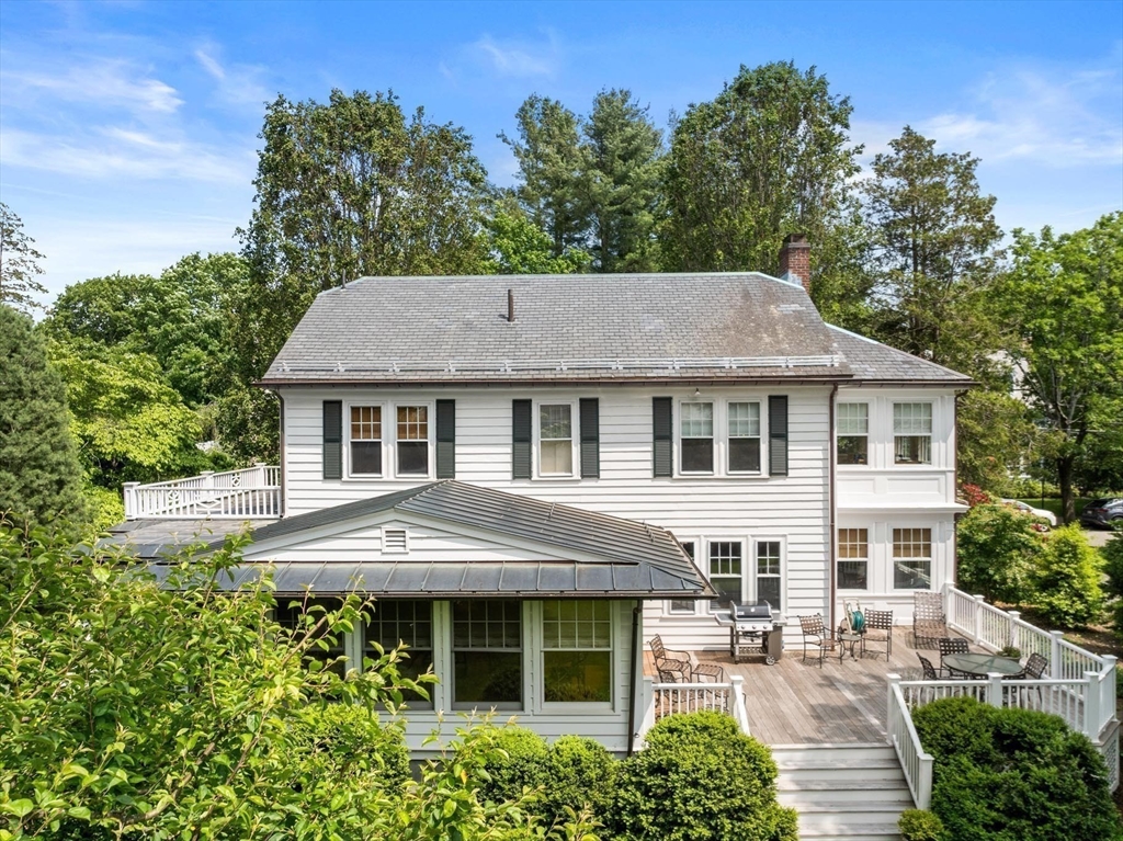 26 Dorset Road Newton, MA 02468 - Photo 20 of 22 a aerial view of a house with yard and green space