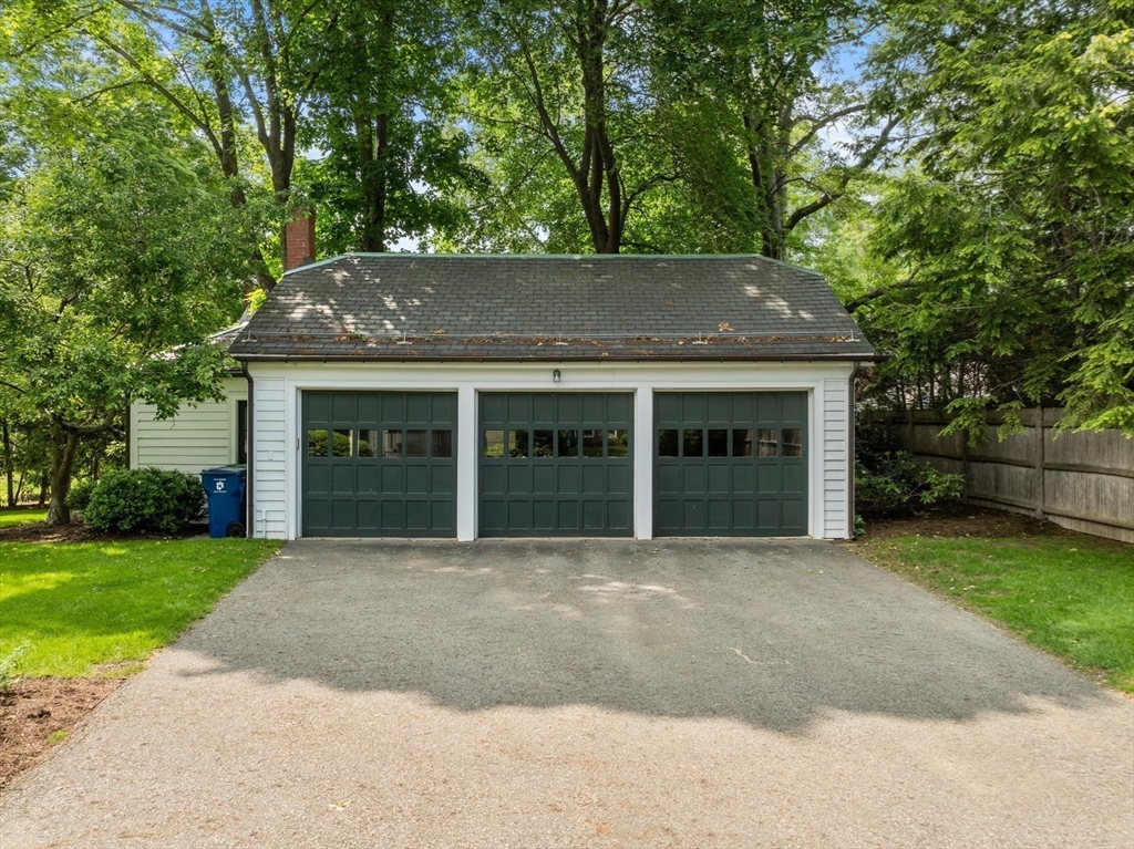 26 Dorset Road Newton, MA 02468 - Photo 21 of 22 a front view of a house with a garden and yard
