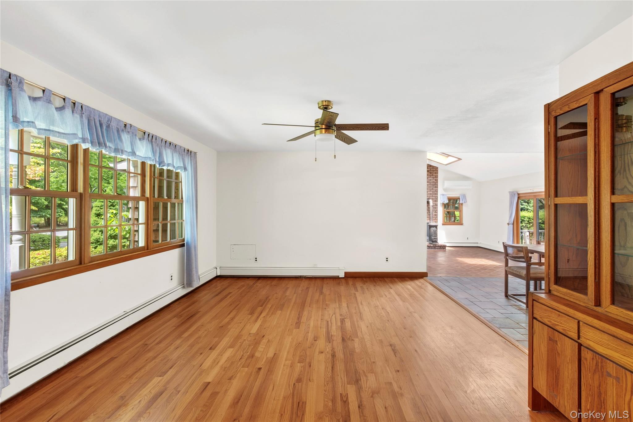 250 Paradise Point Road Southold, NY 11971 - Photo 7 of 24 wooden floor in an empty room with a window