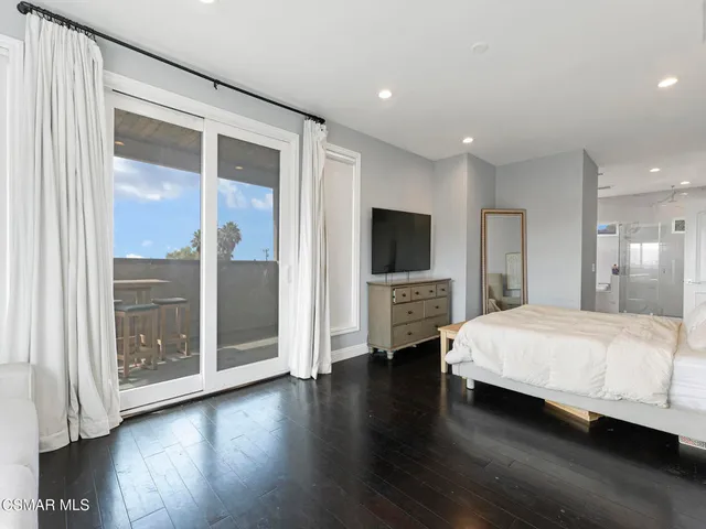 a room with a bed and a television in it