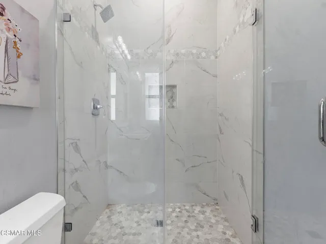 a view of a patio with couches and potted plants