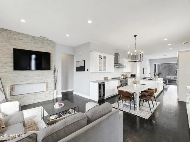 a living room with fireplace furniture and a flat screen tv
