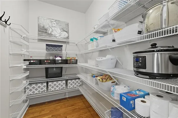a view of a dining room with furniture wooden floor and chandelier