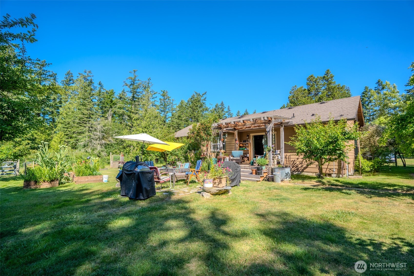 5178 Orcas Road Orcas Island, WA 98245 - Photo 2 of 37 a view of backyard with outdoor seating and green space