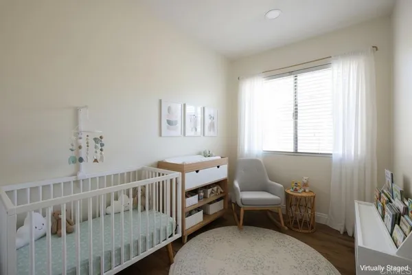 a room with furniture a rug and a window