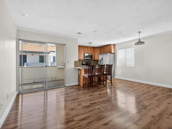 a view of kitchen and dining room with wooden floor