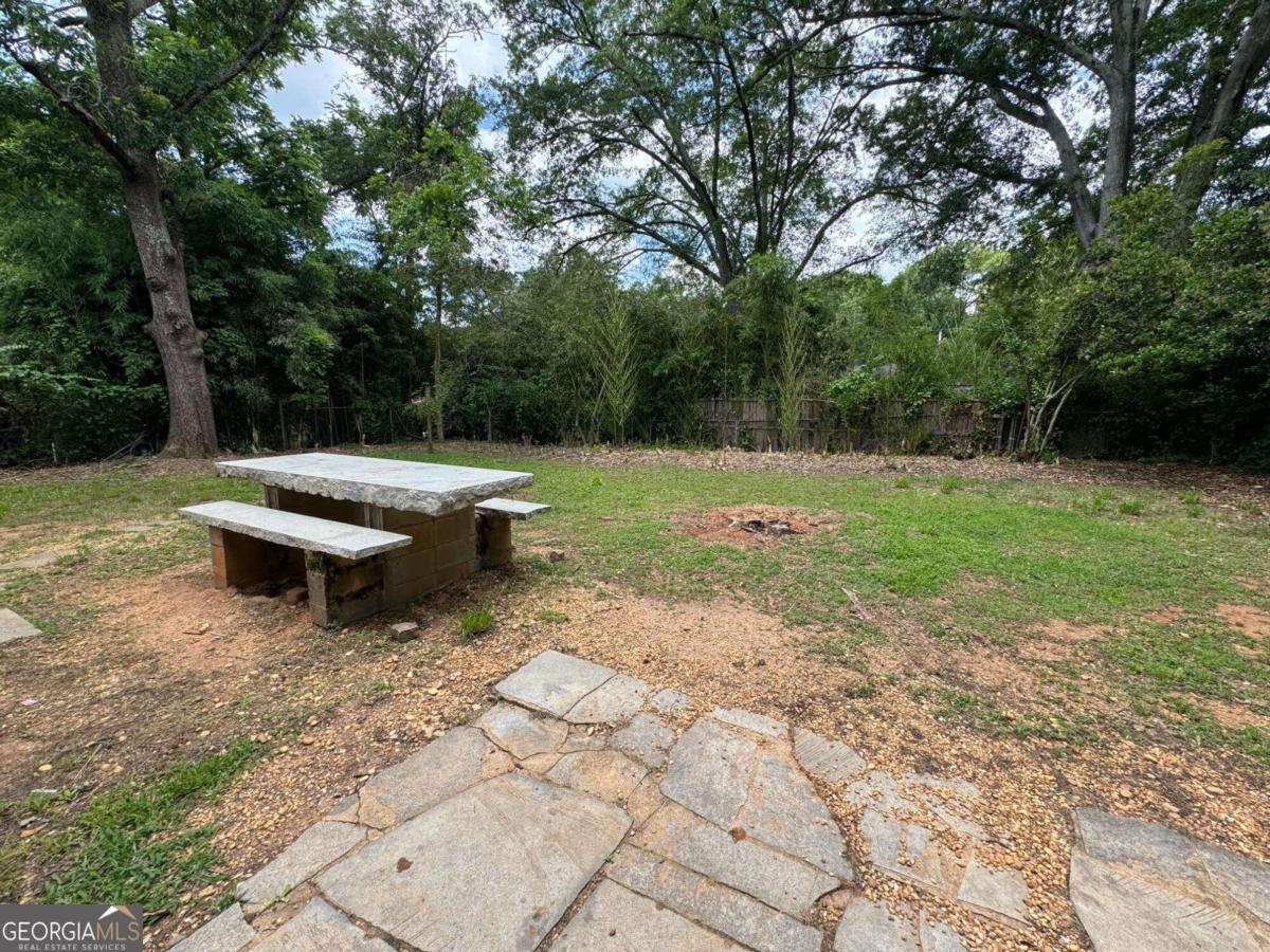 285 Willow Run Athens, GA 30606 - Photo 12 of 12 a backyard of a house with yard and trampoline