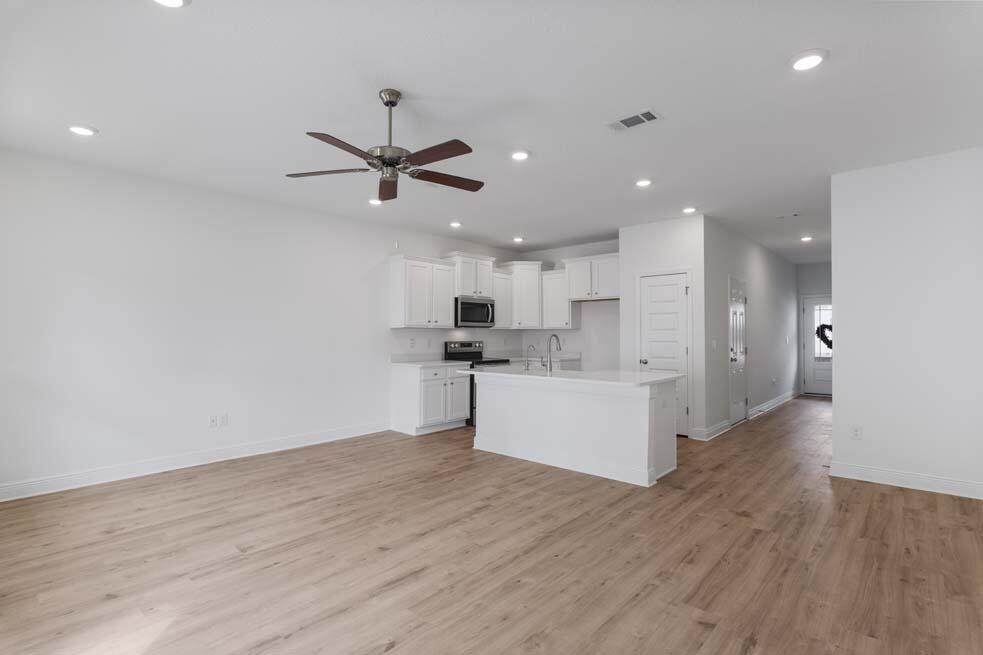 29 Phoenix Street Santa Rosa Beach, FL 32459 - Photo 5 of 26 a view of kitchen with microwave a sink and refrigerator