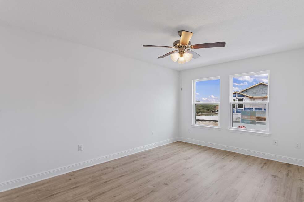 29 Phoenix Street Santa Rosa Beach, FL 32459 - Photo 10 of 26 an empty room with windows and fan