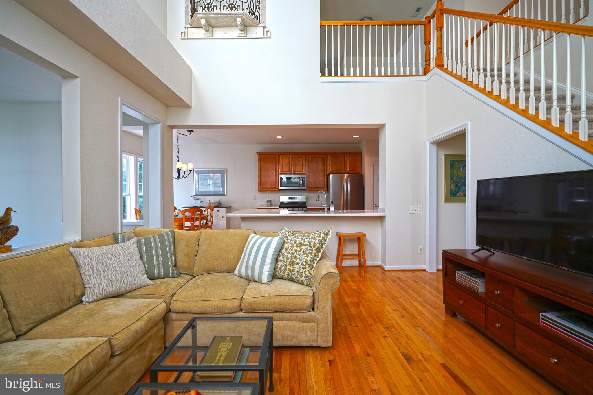 34953 Compass Cove Lewes, DE 19958 - Photo 14 of 90 a living room with furniture and a flat screen tv