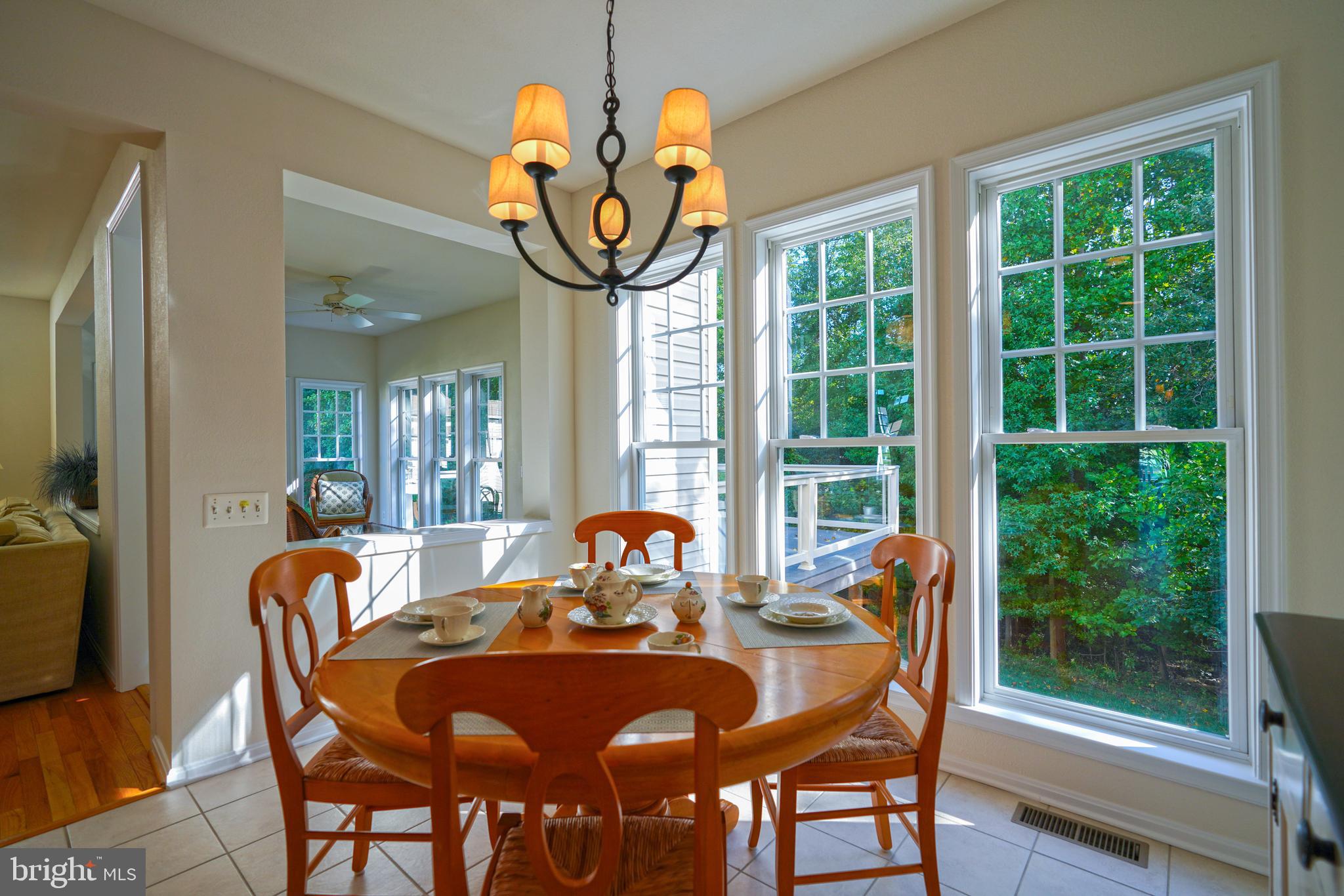34953 Compass Cove Lewes, DE 19958 - Photo 22 of 90 a view of a dining room with furniture window and outside view