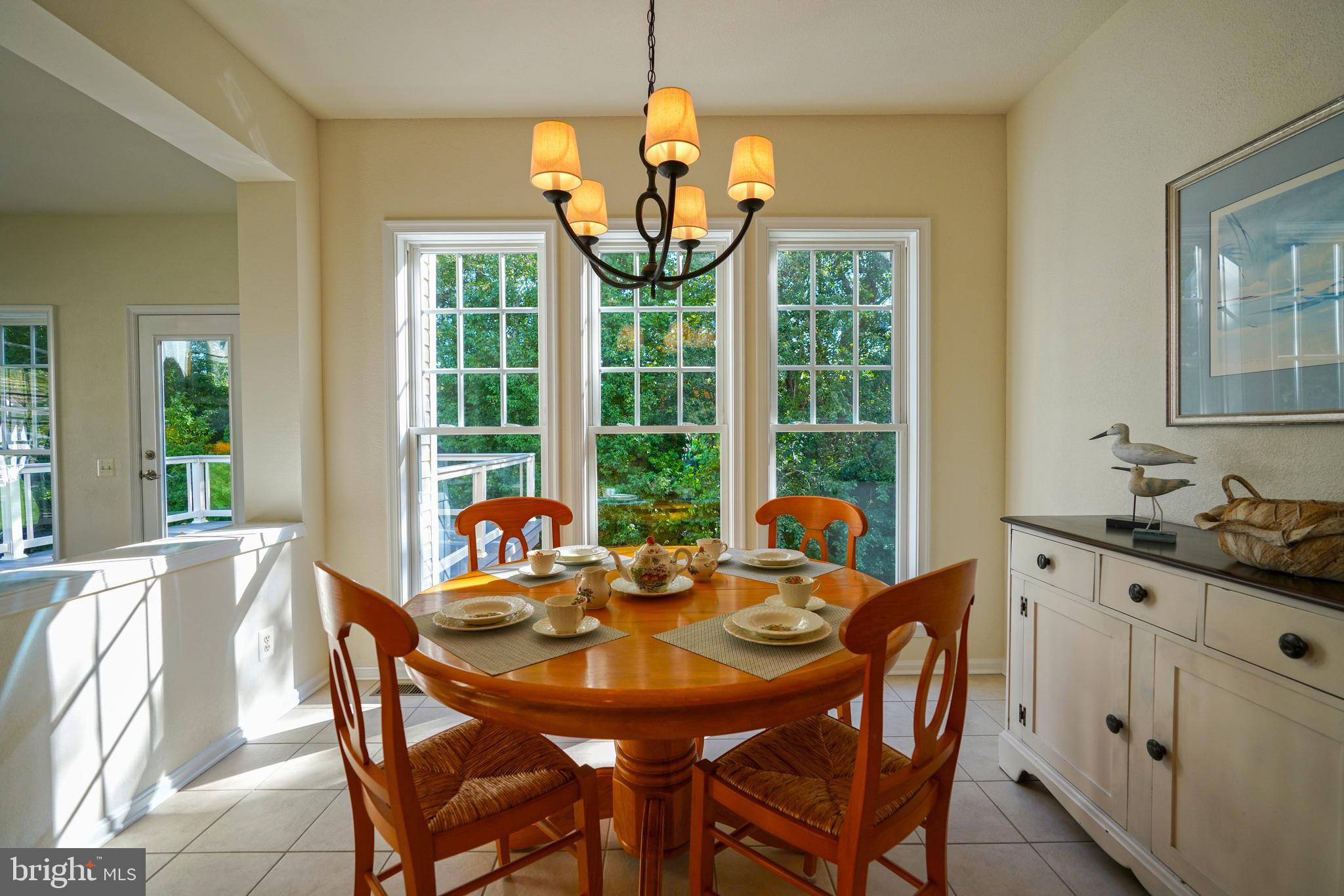 34953 Compass Cove Lewes, DE 19958 - Photo 23 of 90 a dining room with furniture a chandelier and window