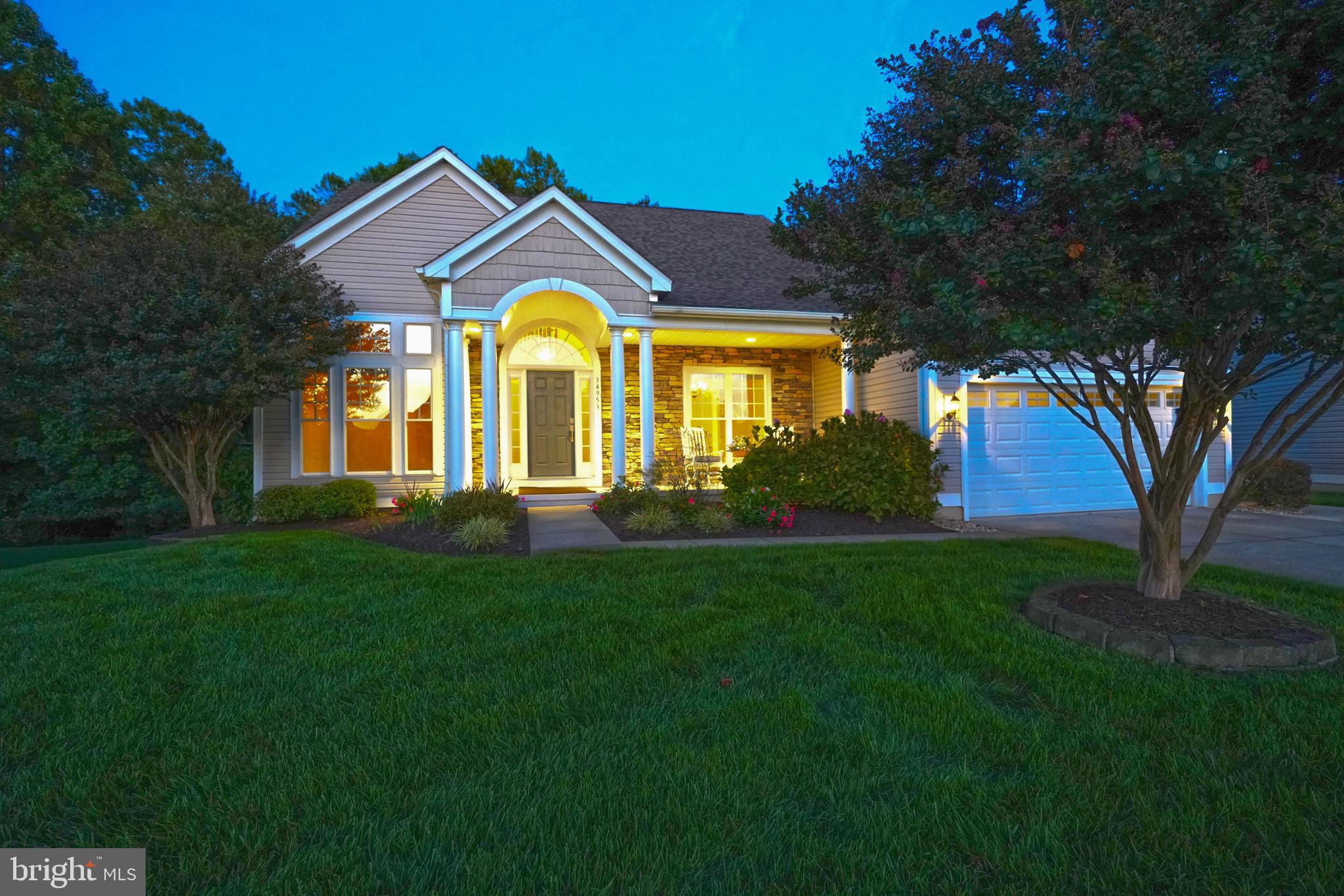 34953 Compass Cove Lewes, DE 19958 - Photo 3 of 90 a front view of house with yard and green space