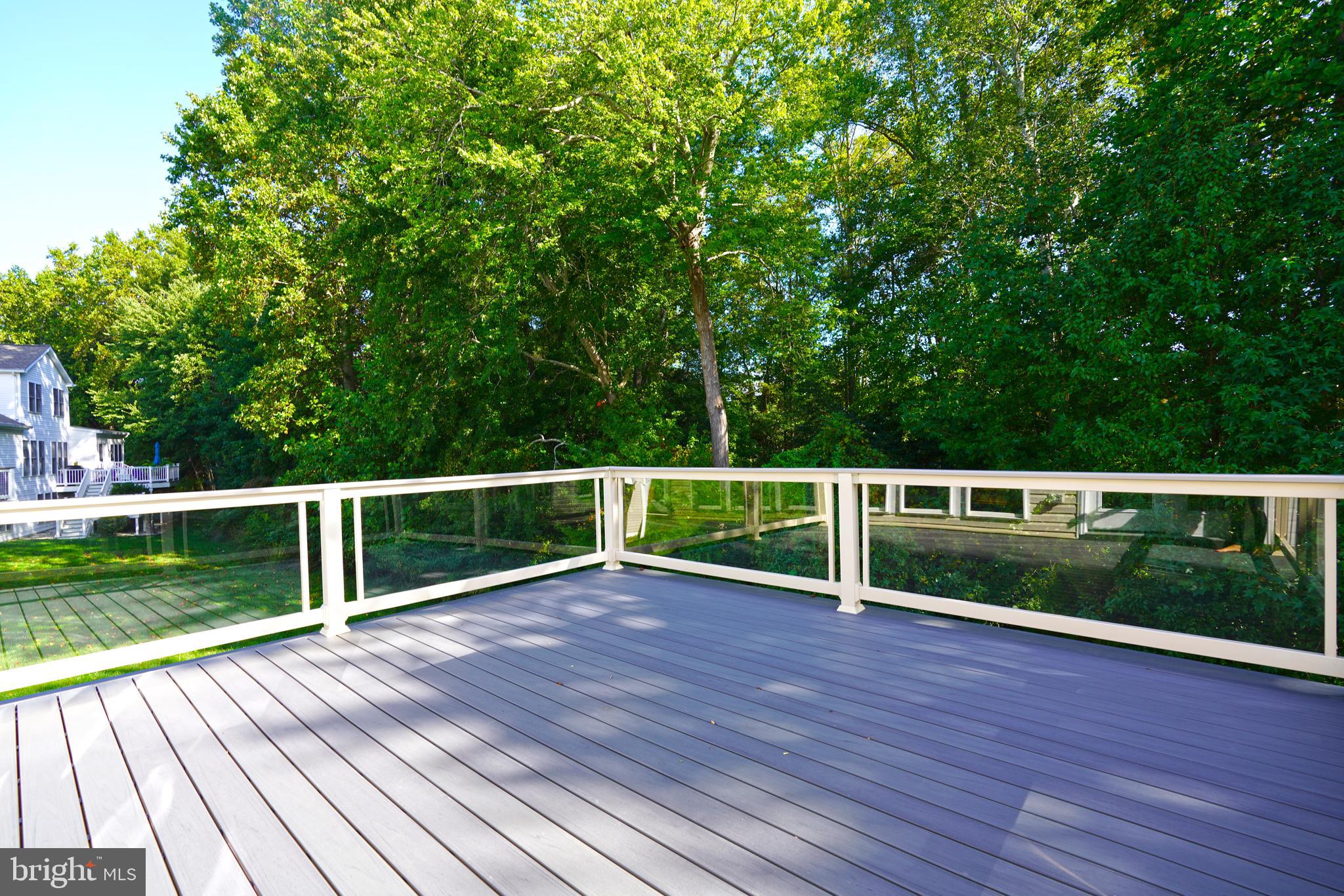 34953 Compass Cove Lewes, DE 19958 - Photo 33 of 90 a view of a yard with wooden deck