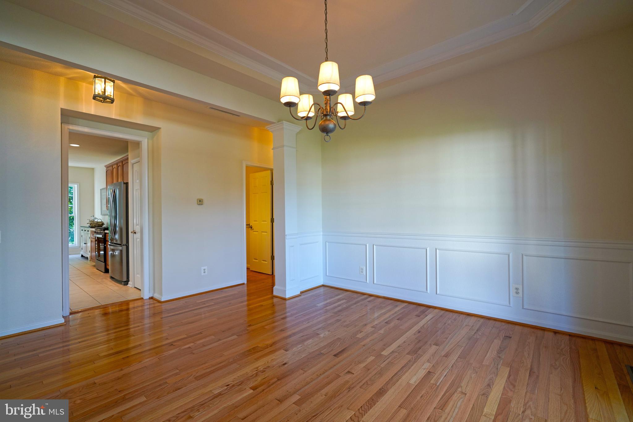 34953 Compass Cove Lewes, DE 19958 - Photo 36 of 90 a view of an empty room with wooden floor