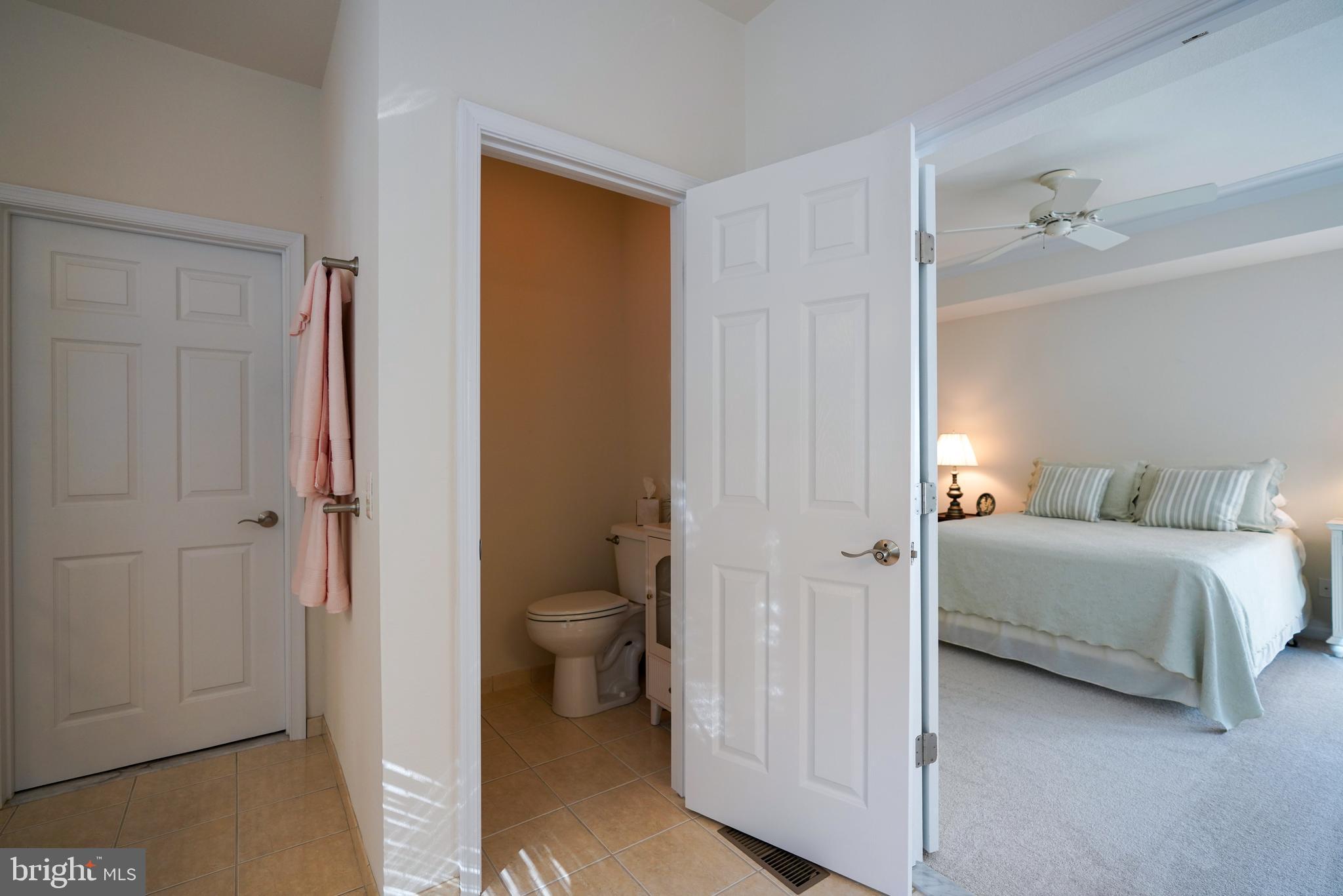 34953 Compass Cove Lewes, DE 19958 - Photo 46 of 90 a bathroom with a toilet and a shower