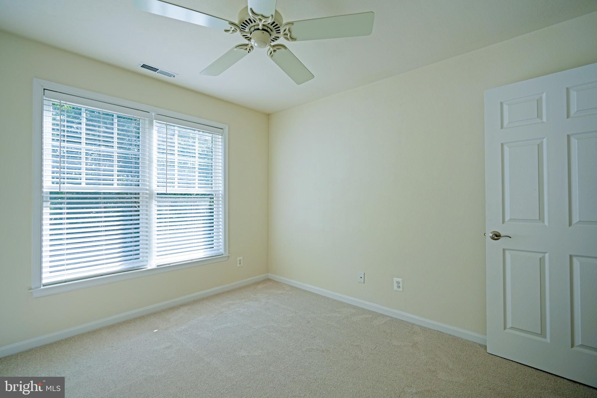 34953 Compass Cove Lewes, DE 19958 - Photo 56 of 90 a view of an empty room with a window