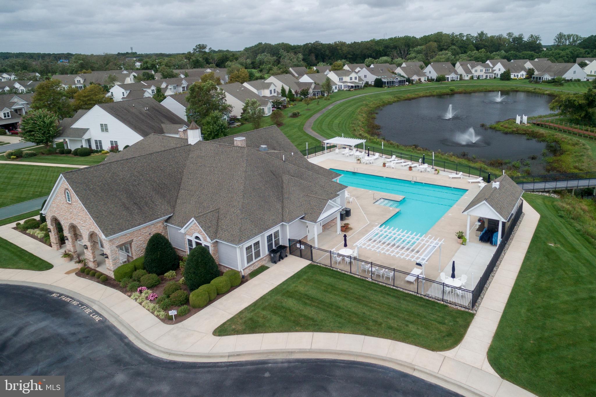 34953 Compass Cove Lewes, DE 19958 - Photo 84 of 90 an aerial view of a house with a garden and lake view