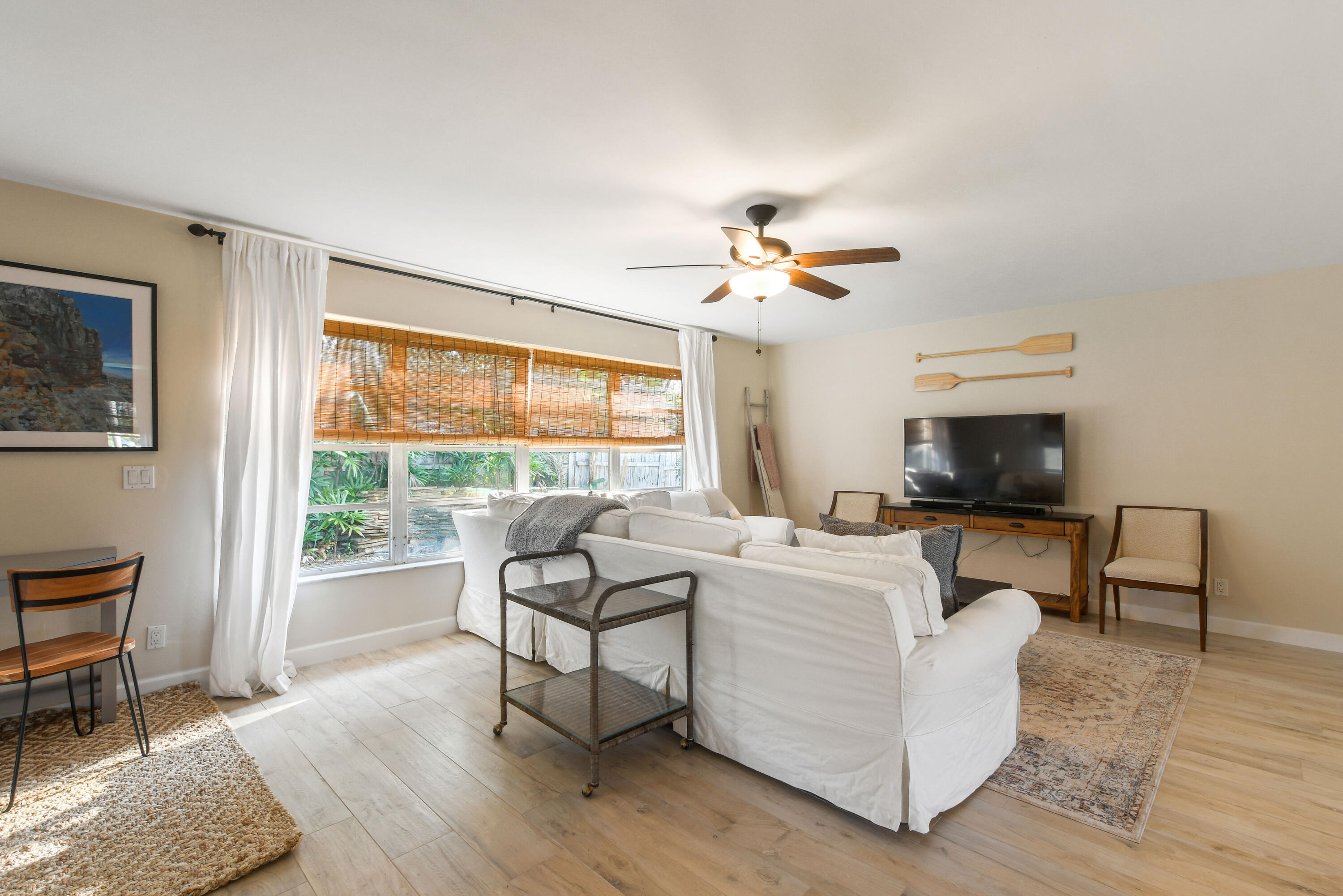 108 Norfolk Road Jupiter, FL 33469 - Photo 11 of 23 a living room with furniture and a fireplace
