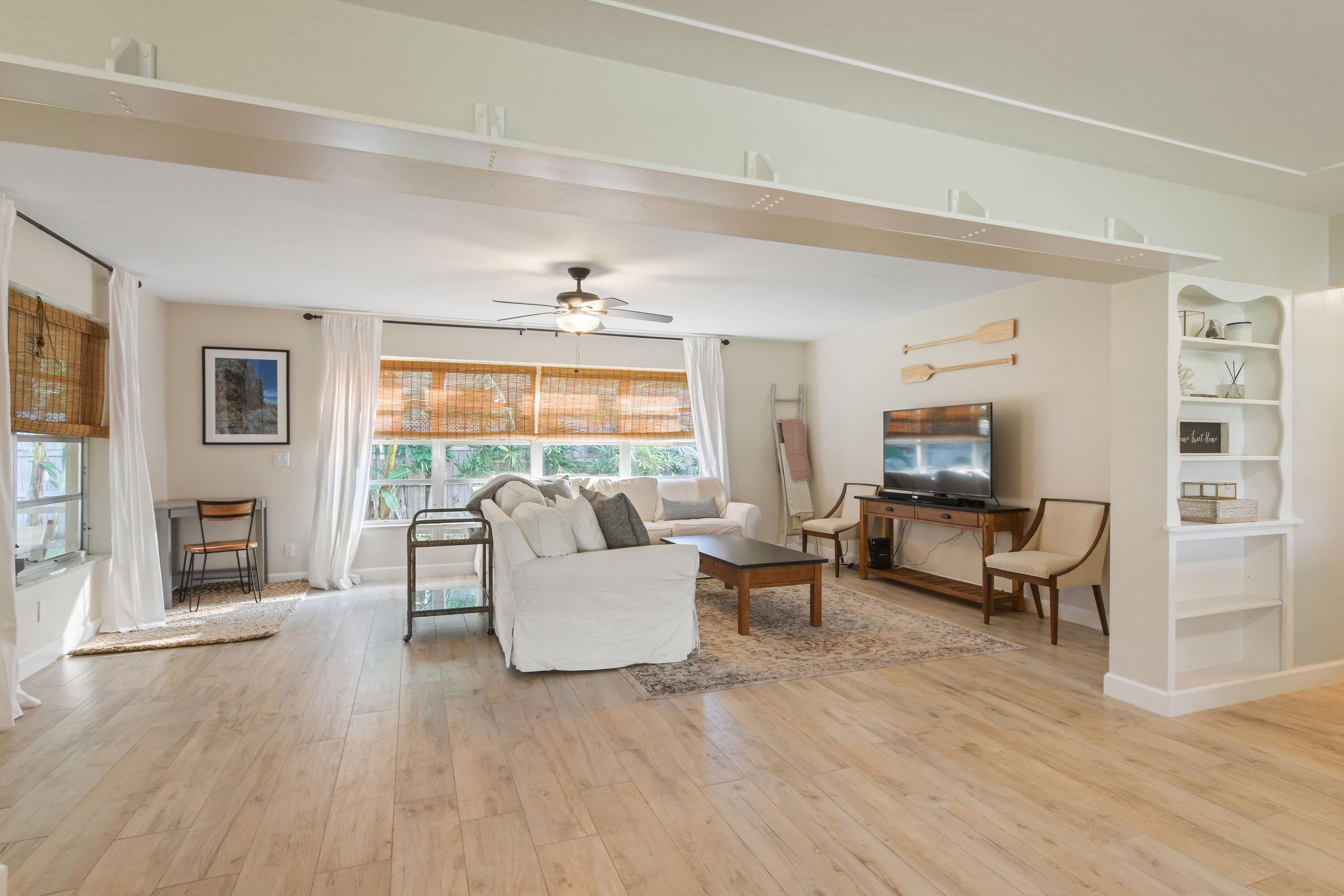 108 Norfolk Road Jupiter, FL 33469 - Photo 12 of 23 a living room with furniture and a large window