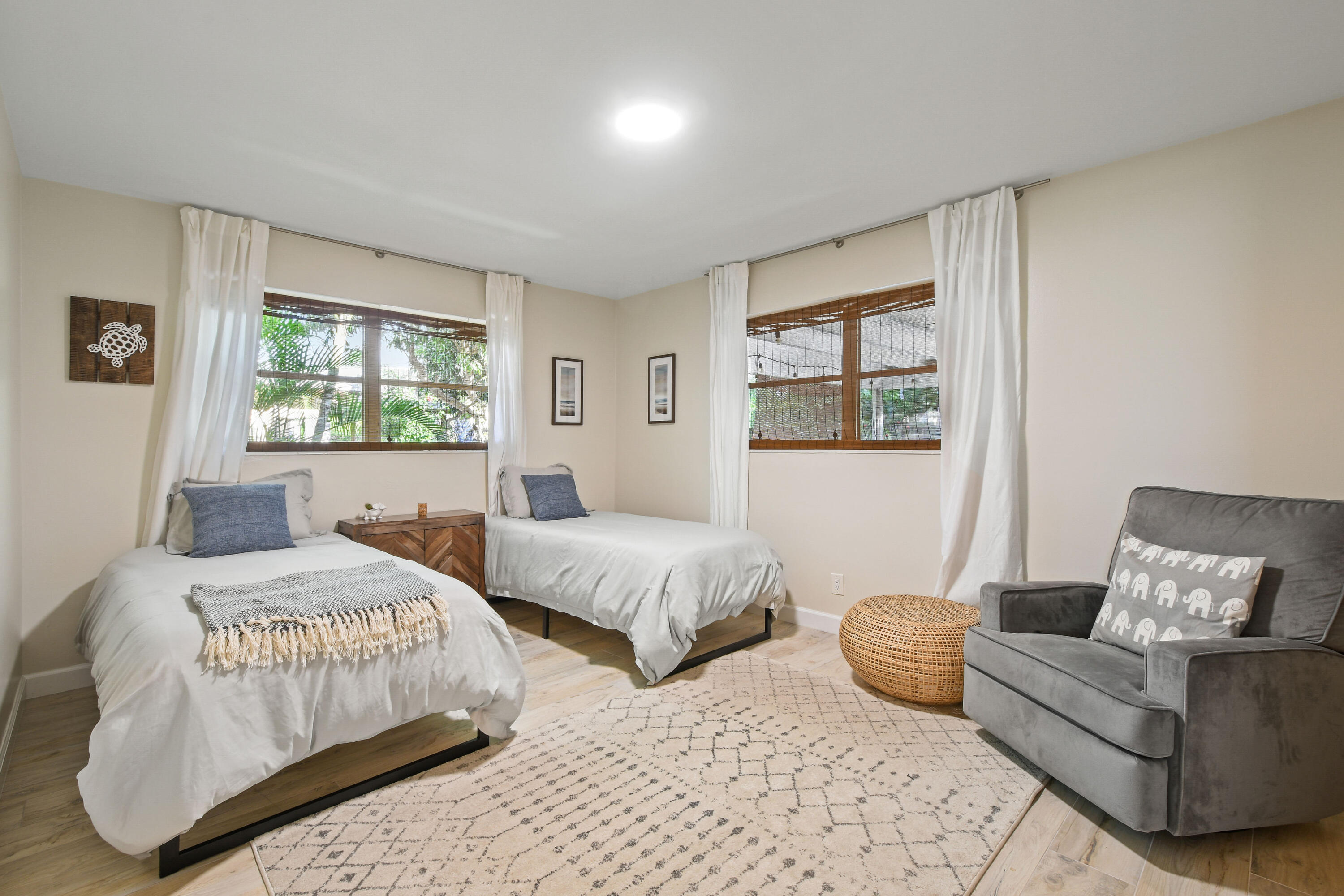 108 Norfolk Road Jupiter, FL 33469 - Photo 17 of 23 a bedroom with two beds and a couch