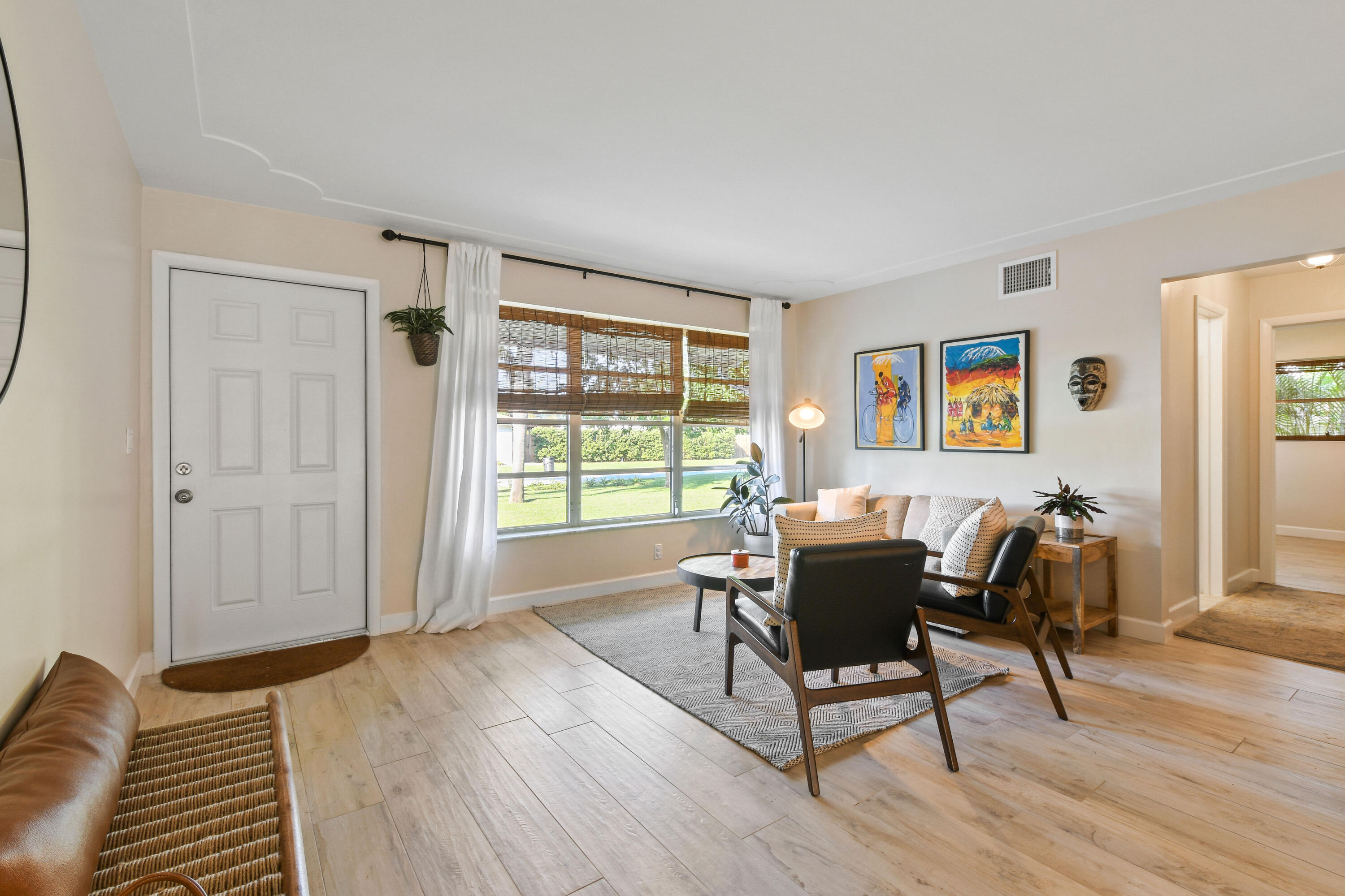 108 Norfolk Road Jupiter, FL 33469 - Photo 7 of 23 a living room with furniture and a window