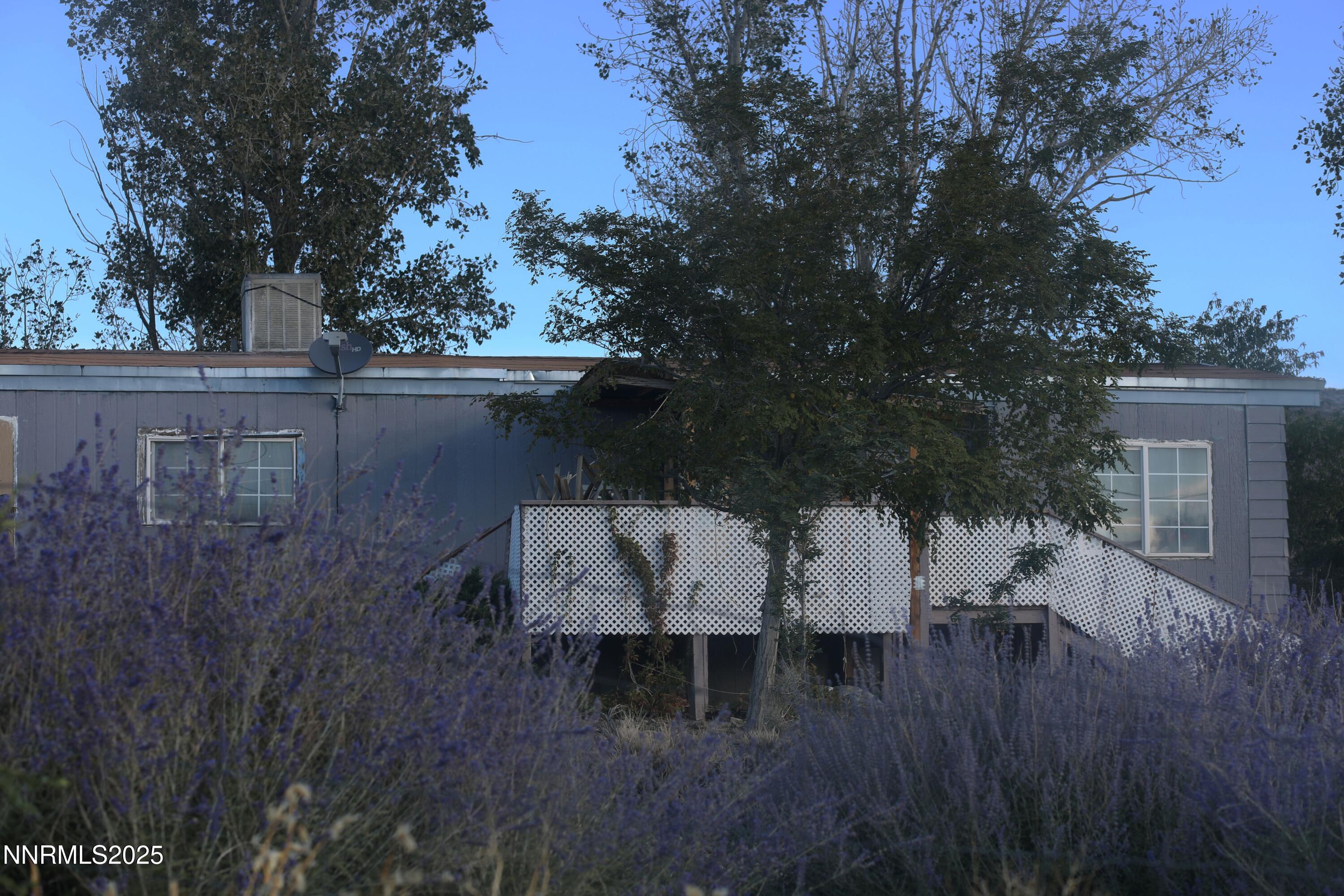 a view of house with patio and wooden floor