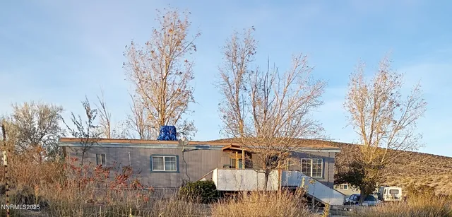 a view of a building with a yard