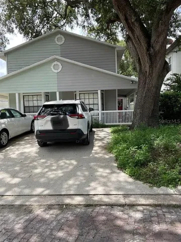 a car parked in front of a house