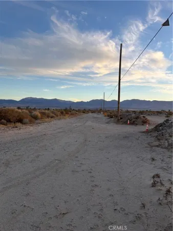 a view of a road with an ocean view