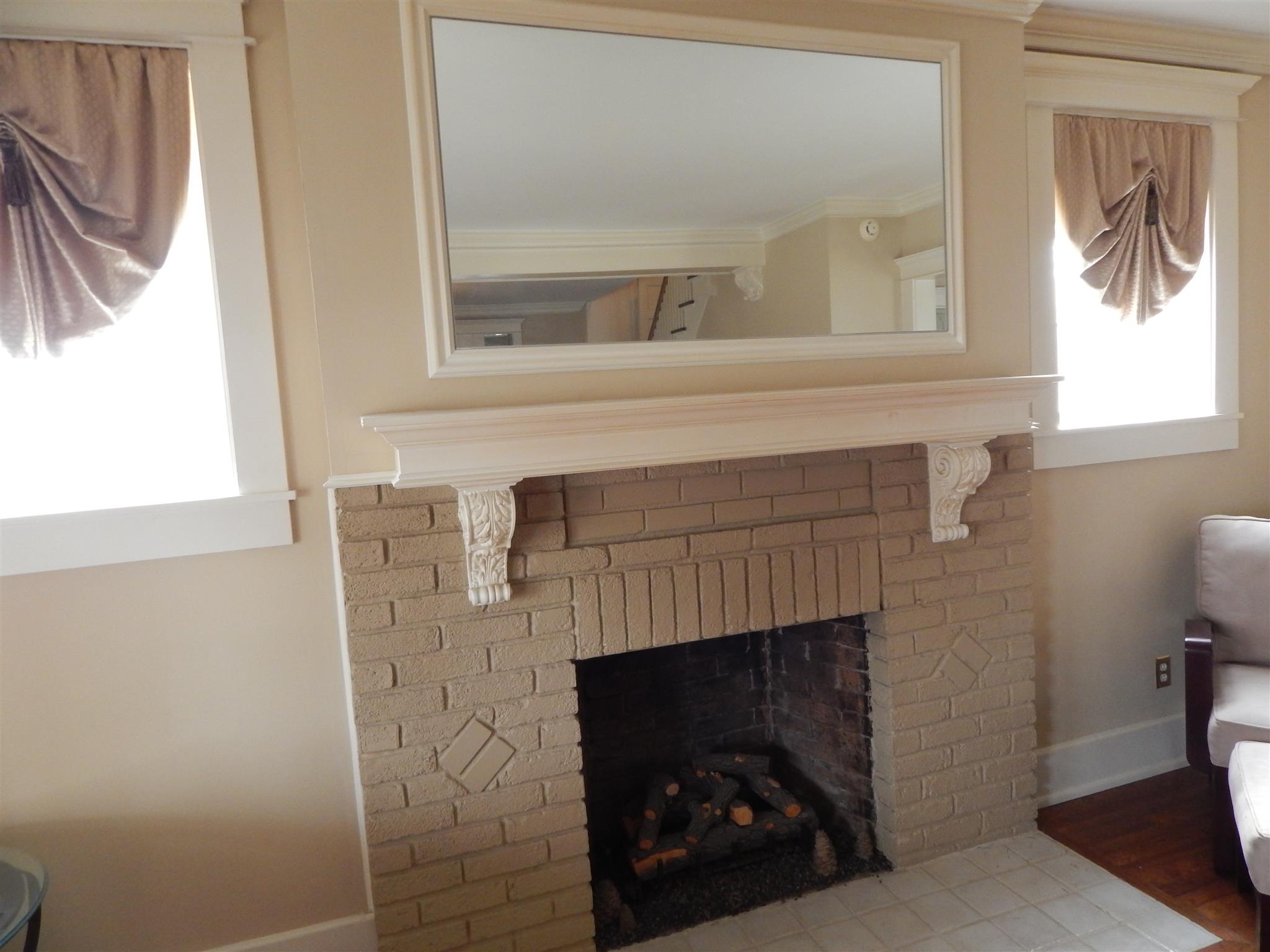 1300 Riverside Drive Old Hickory, TN 37138 - Photo 7 of 24 a living room with a fireplace windows and a painting