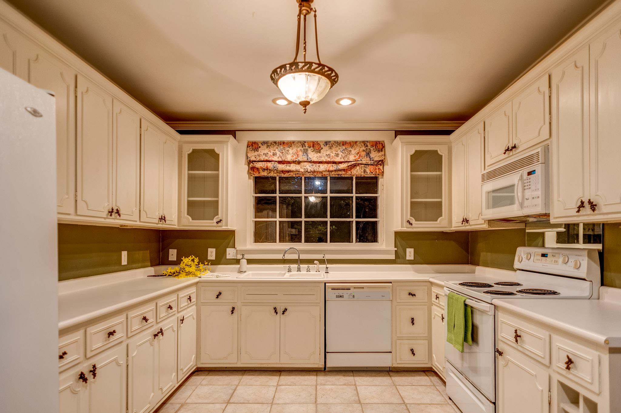 1300 Riverside Drive Old Hickory, TN 37138 - Photo 8 of 24 a kitchen with a sink stove and cabinets