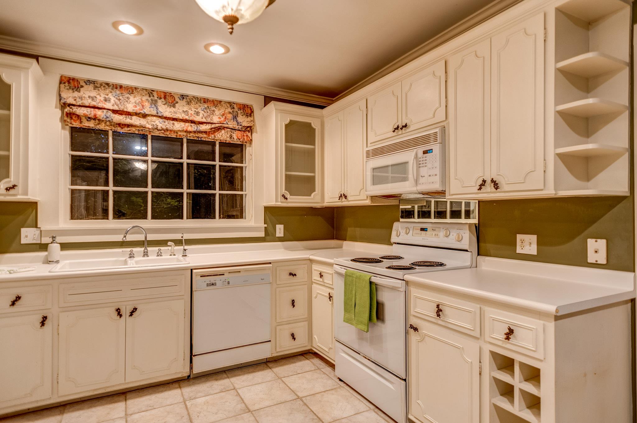 1300 Riverside Drive Old Hickory, TN 37138 - Photo 9 of 24 a kitchen with a stove sink and cabinets