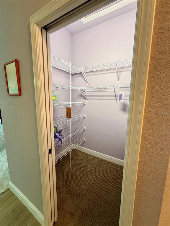 13110 Bamboo Street Spring Hill, FL 34609 - Photo 28 of 56 a view of storage and utility room with racks on the wall