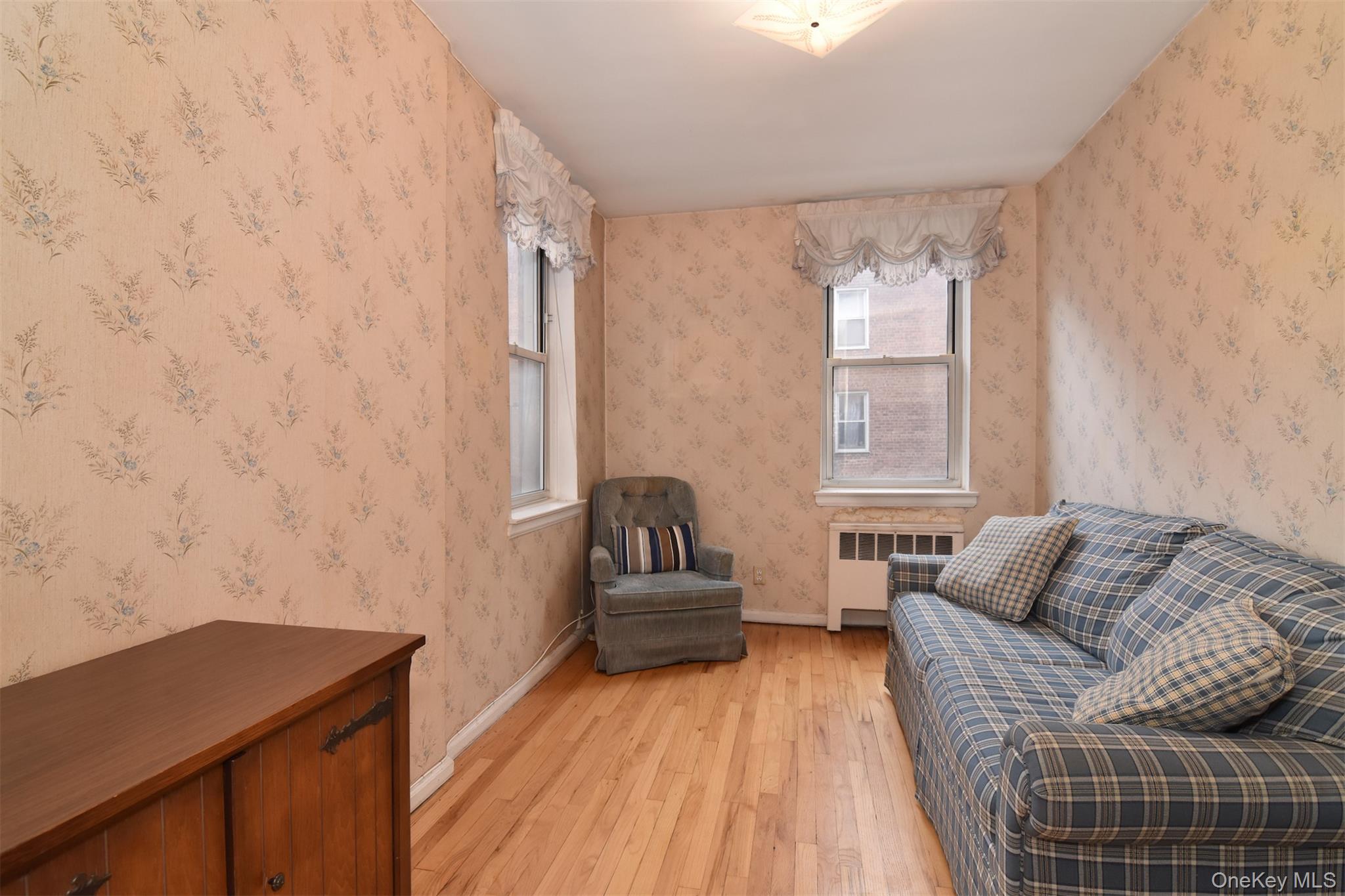 1 Georgia Avenue, Unit 3E Bronxville, NY 10708 - Photo 10 of 13 a living room with furniture and wooden floor