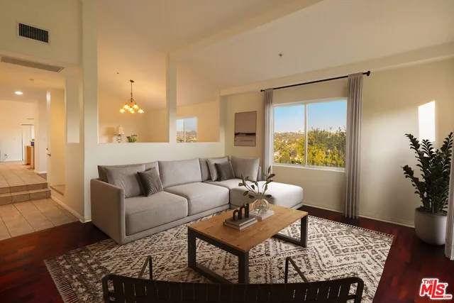 a view of a patio with table and chairs with wooden floor and fence