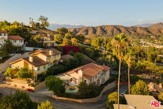 a living room with furniture a rug and a fireplace