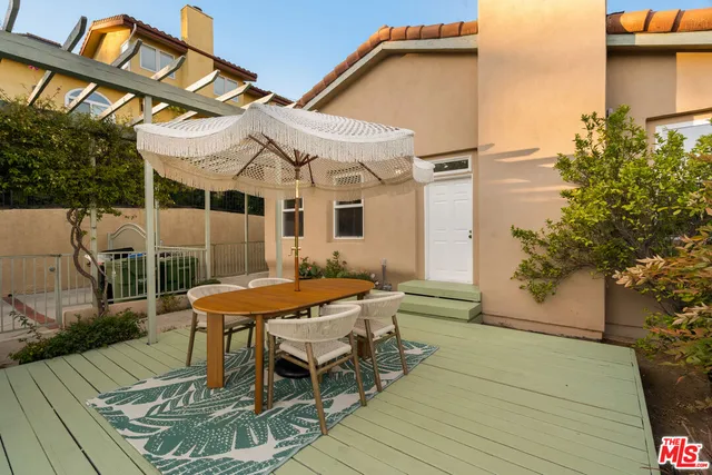 a bathroom with a granite countertop sink mirror and vanity