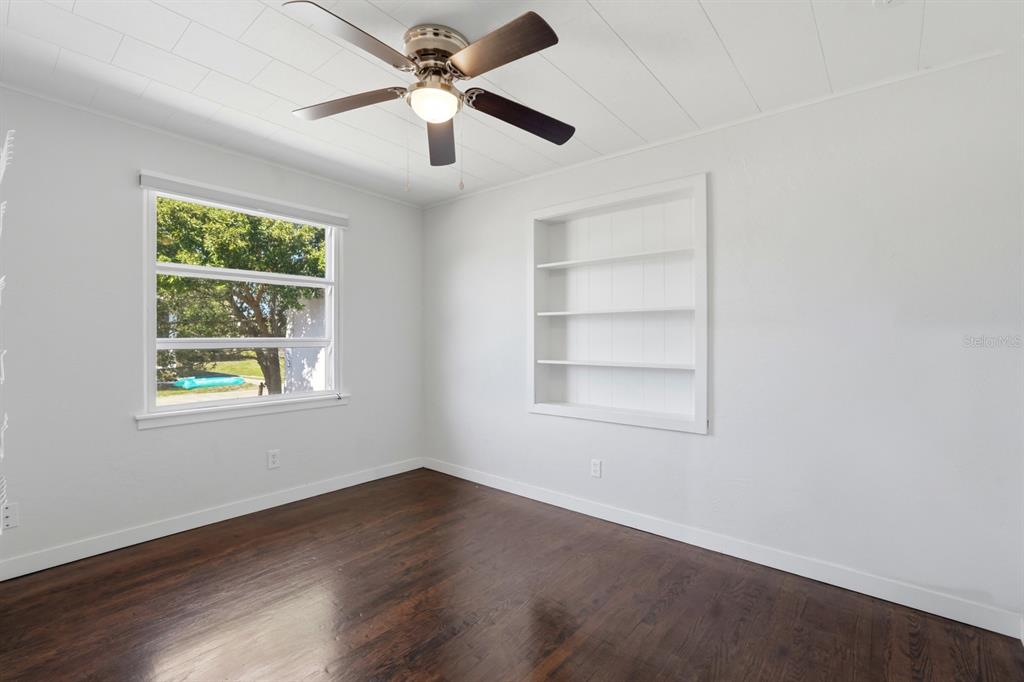231 North Ridgewood Avenue Ormond Beach, FL 32174 - Photo 22 of 52 an empty room with a window and a fan