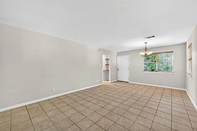 a view of an empty room and window