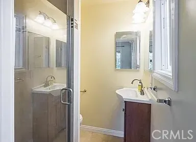 a bathroom with a sink and mirror