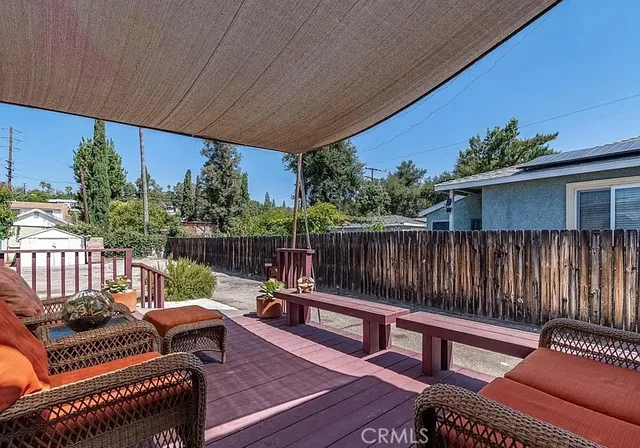 a view of a chairs and table in a patio