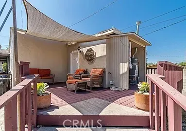 a view of a chairs and table in a patio