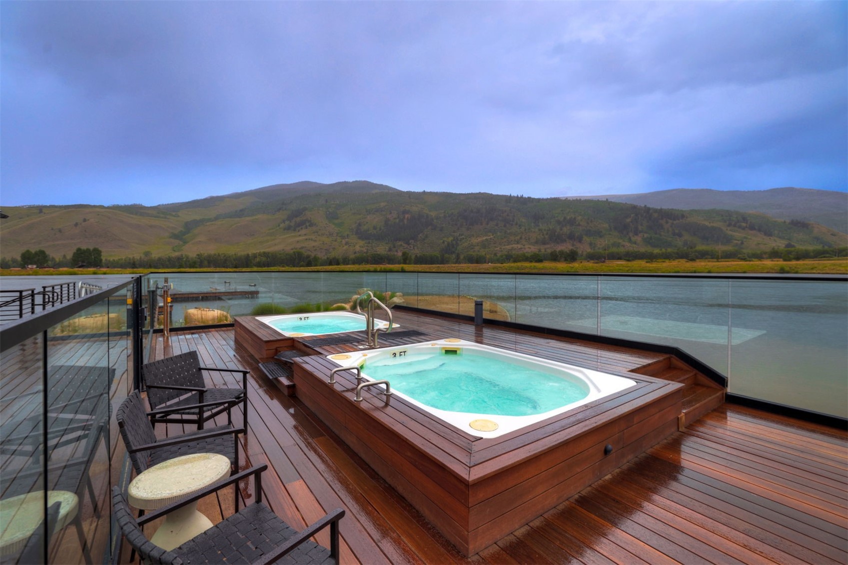 21 Moss Way Silverthorne, CO 80498 - Photo 49 of 50 a view of a roof deck with couches and wooden floor