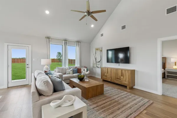 a living room with furniture and a flat screen tv