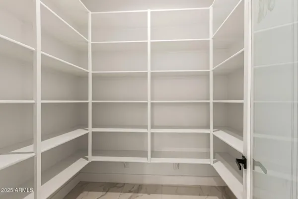 a view of an empty room with windows
