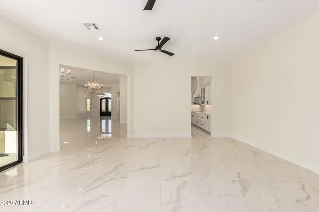 a spacious bathroom with a bathtub sink and mirror